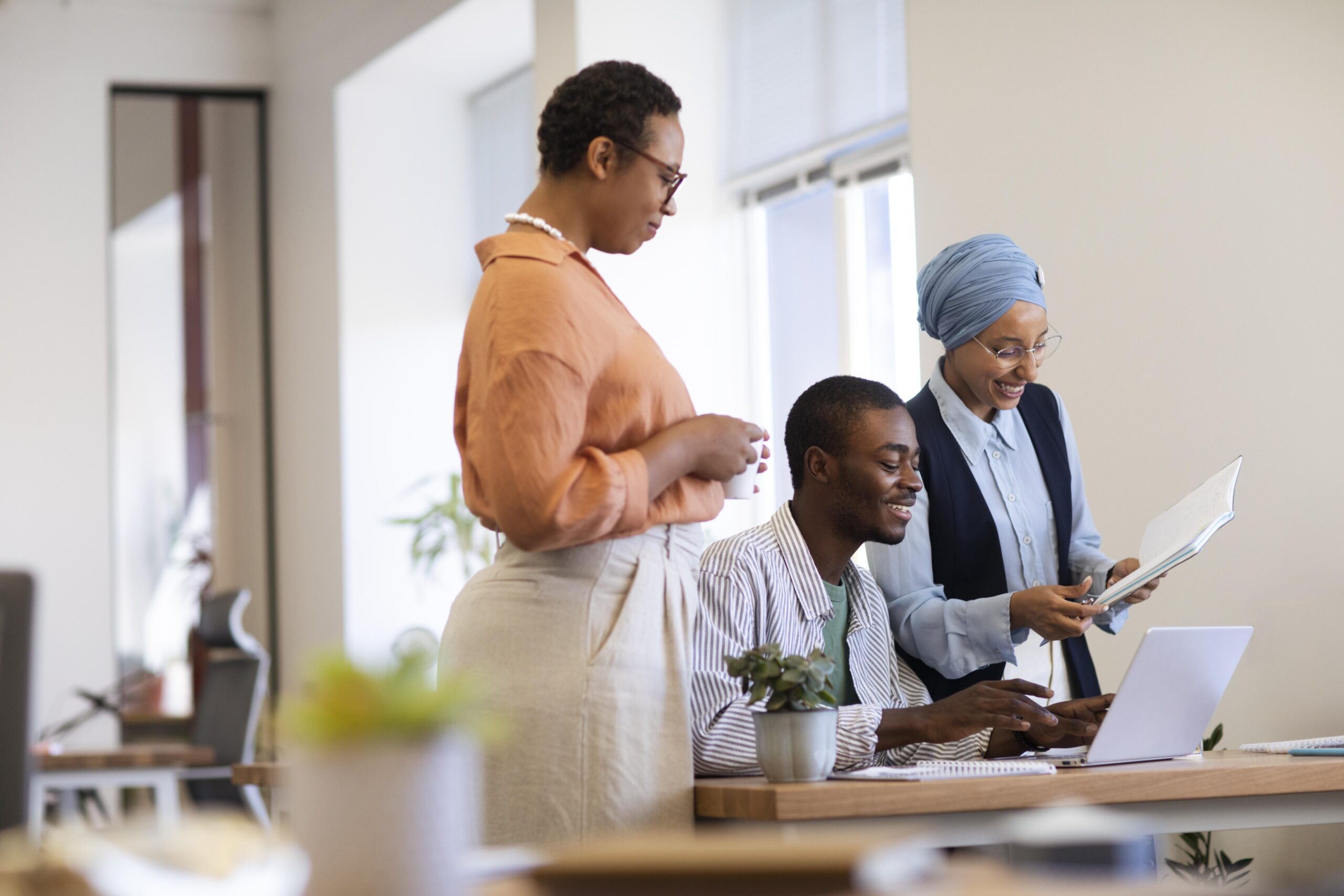 male-employee-getting-used-his-new-office-job-along-with-female-colleagues (2)